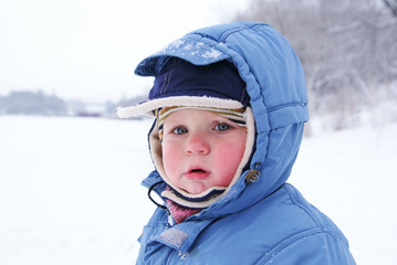 cute boy in snowsuit