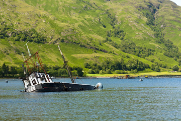 Partially submerged fishing vessel in Loch Linnie © Hugh McKean
