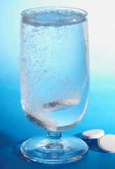 Pills dissolving in water