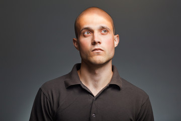 pensive young man in shirt