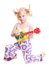 girl playing his toy guitar