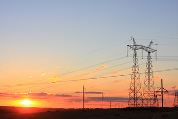 Fototapeta na wymiar Electricity pylon on sunrise