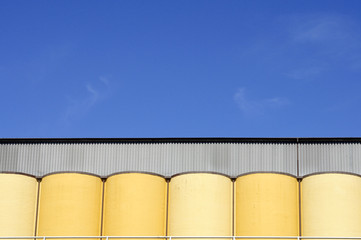 Colorful silo against a blue sky