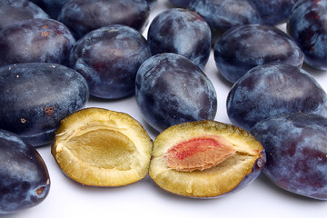 group of purple plums close up