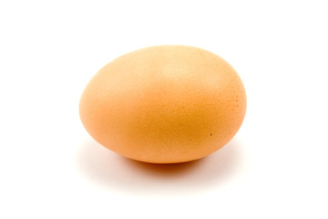 brown chicken egg over a white background