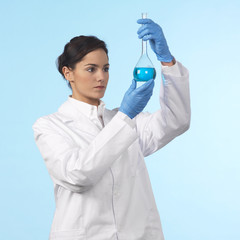 lab technician holding a flask