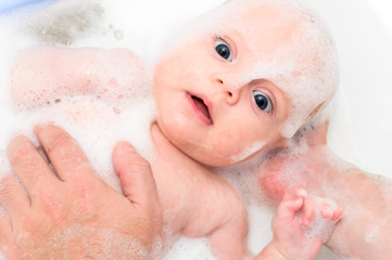 Fototapeta premium baby taking a bath