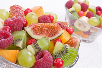 Mix of different fruits and berries salad close-up