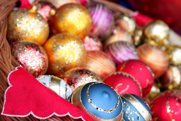 Christmas baubles in wicker basket, background