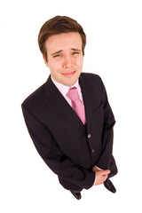 very sad businessman crying after failure, isolated on white