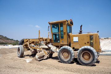 Fototapeta premium Large tractor working on a new road