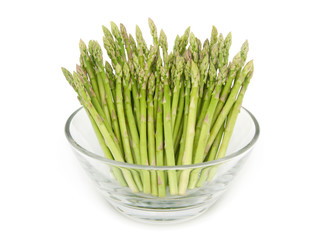 Baby asparagus in a bowl isolated on white background