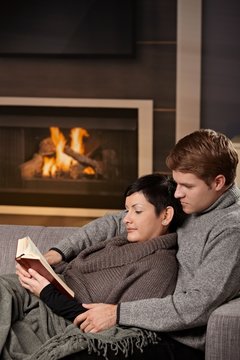 Couple reading at home