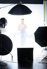 Young beautiful model posing in professionally equipped studio