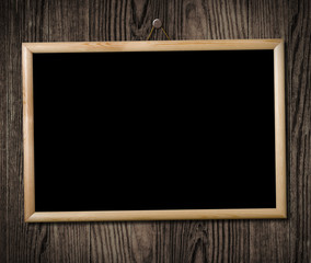 Vintage picture frame on wooden wall, clipping path.