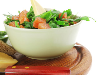 salad with smoked salmon in green bowl