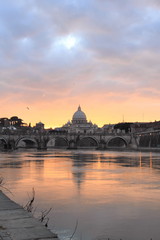 Obraz premium view of Vatican reflected on Tiber river in Rome at sunset