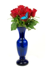 Red roses in vase with butterlfy