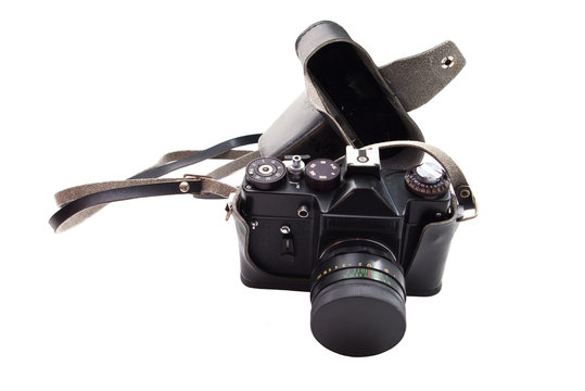 An old film reflex camera isolated on white