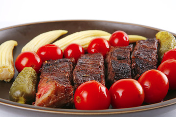 meat served with baby corns