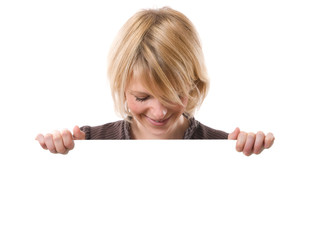 young smiling woman looking a white board under