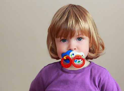 Little girl with pacifier