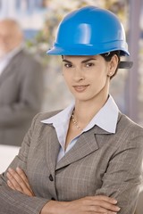 Portrait of businesswoman wearing hardhat