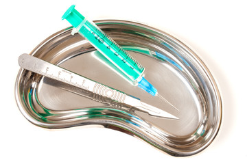 Green Syringes and scalpel