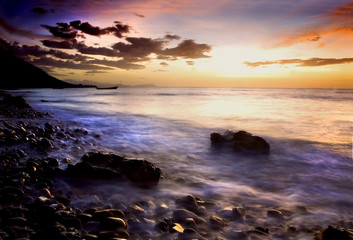 Sunset over rocky coast