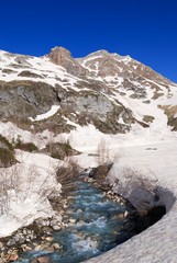 blue roshing river in a snowbound mountains