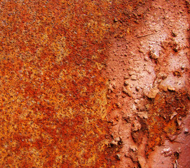 very rusty plate of red metal