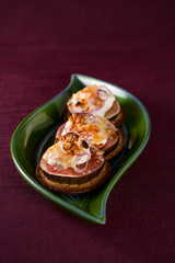 figs and cheese on cracker