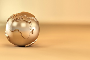 Gold three-dimensional earth on yellow background