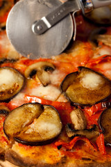 Pizza with eggplants, bell peppers and mushrooms