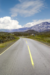Asphalt road to mountains
