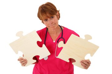 Nurse Holding Two Puzzle Pieces