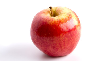 Natural tasty red apple isolated on white.