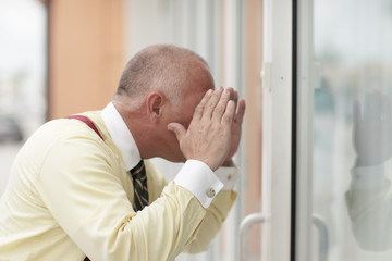 Man looking through the glass