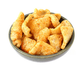 Barbeque seasoned pork rinds in an old bowl