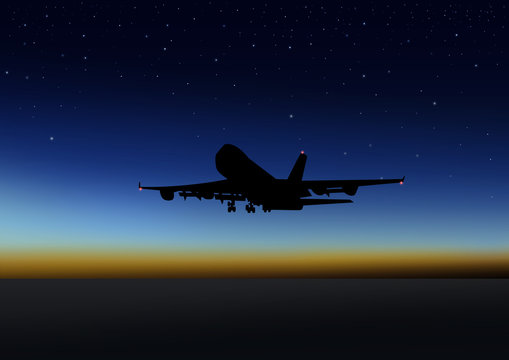 Stock image of airplane flying at night