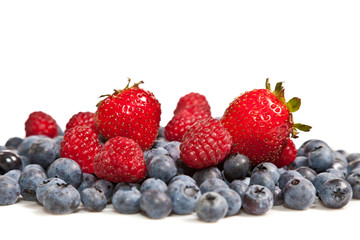 Composition of ripe black and red raspberries, strawberries and