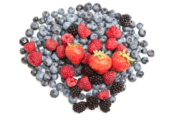 Composition of ripe black and red raspberries, strawberries and