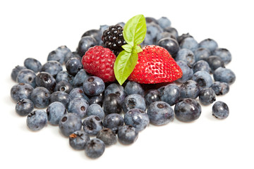 Composition of ripe black and red raspberries, strawberries and