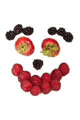 Composition of ripe black and red raspberries, strawberries and