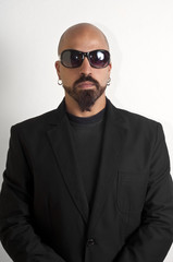 Obraz premium blacks man with glasses, beard and black jacket