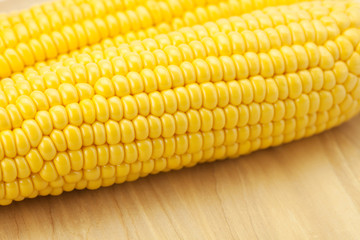 Corn lying on a cutting board