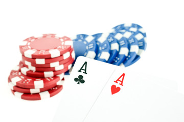 color poker chips and two aces cards