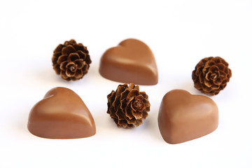 Heart shaped chocolates and pine cones