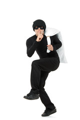 Criminal running away carrying a bag isolated against white back