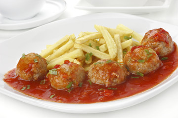 Meatballs in tomato sauce with french fries